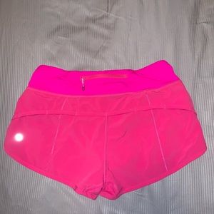 Never worn pink Lululemon Speed Up Short. Size 4.